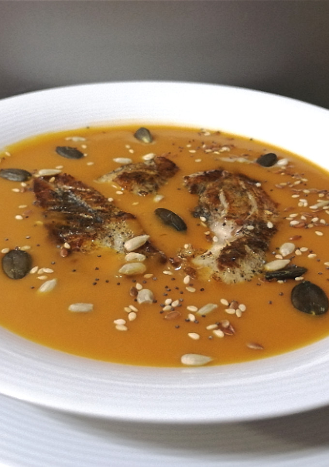 Una foto de Corvina en crema de bogavante y cigalas