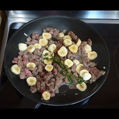 A picture of Beef Stir Fry with Plantain, Thyme and a Garlic-Lemon sauce.