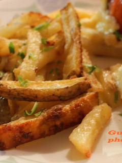 Una foto de Papas con queso parmesano y ajo al horno