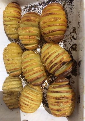A picture of Hassleback rosemary and garlic new potatoes.