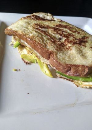 A picture of Unleavened bread or sandwich bread with avocado and egg.