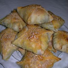 A picture of Kalitsounia with spinach and mizithra.