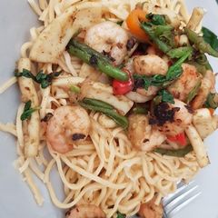 A picture of My Garlic Stir fry King prawns & chopped Squid & Noodles.