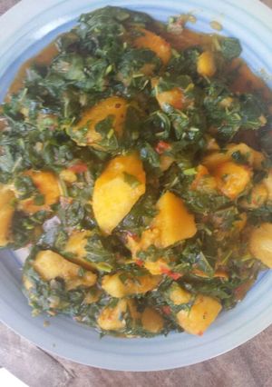 A picture of Porridge yam with spinach leave.