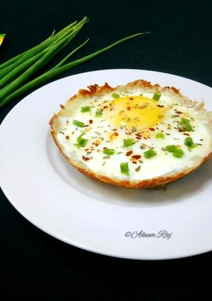 A picture of Egg And Cheese Topped Hash Brown Nest.