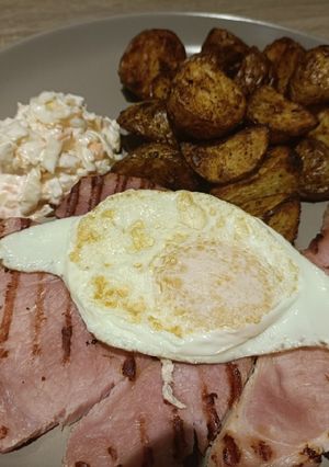 A picture of Gammon steaks with garlic and cajun air fryer potatoes.