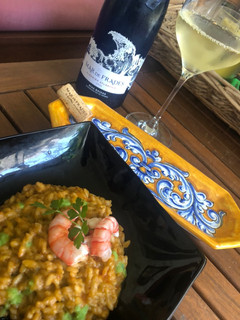 Una foto de Risotto con gambas rojas y guisantes