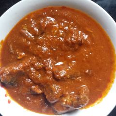 A picture of Tomatoes stew.