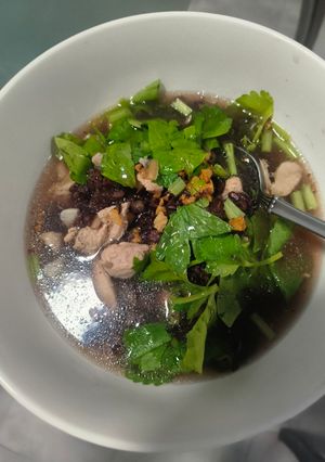 A picture of Riceberry Rice Porridge with Chicken Thigh.