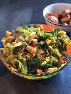 A picture of Leeks and cabbage with chorizo and apple.
