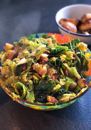 A picture of Leeks and cabbage with chorizo and apple.