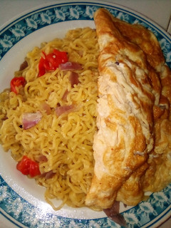 A picture of Noodles with fried egg.