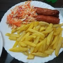 A picture of Chips, Sausage and Kachumbari.