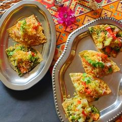 A picture of Hummus pesto papad bites.