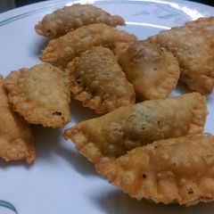 A picture of Besan Karanji/ Besan Gujjiya / Sweet Snacks.