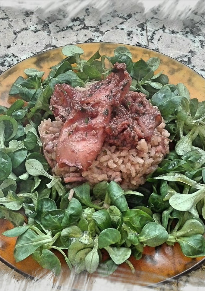 Una foto de Pota con arroz caldoso