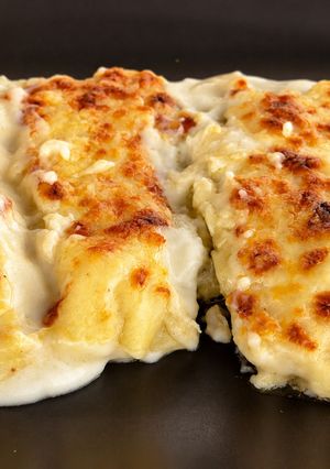 Una foto de Canelones de pollo y champiñones al curry