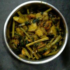 A picture of Lau shak chingri chorchori(bottle gourd leaves prawn curry).