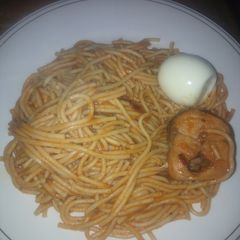 A picture of Spaghetti, fish and egg.