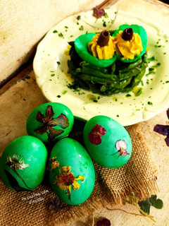 A picture of Stuffed and Colored Hard-Boiled Eggs with Asparagus.