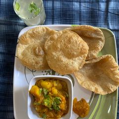A picture of LAPETA AALU AAM KI MITHI Chutney WITH PURI.