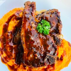 A picture of Pan fried lamb chops with herbed butternut mash.