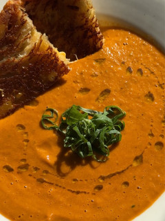 A picture of Roasted Tomato Soup + Grilled Cheese.