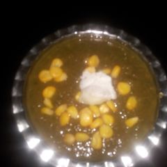 A picture of Daal palak with corn.