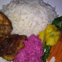 A picture of Baked chicken with steamed vegetables.