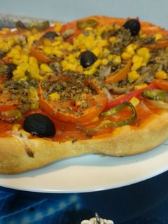 Una foto de Pizza de verduras, un pecado sano!