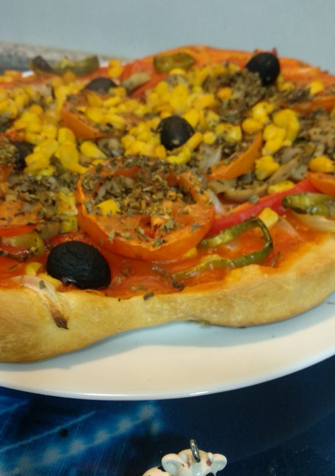Una foto de Pizza de verduras, un pecado sano!