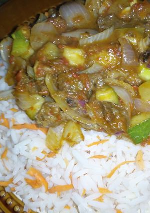 A picture of Rice and cucumber beef sauce.