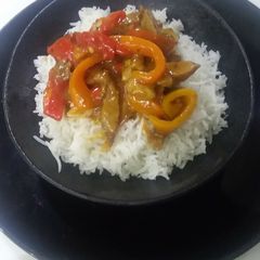 A picture of Crispy chilli beef with white rice.