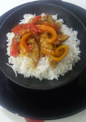 A picture of Crispy chilli beef with white rice.