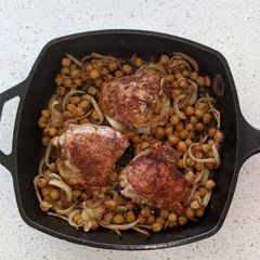 A picture of Chicken thighs with chickpeas.