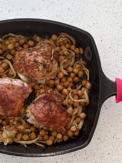 A picture of Chicken thighs with chickpeas.