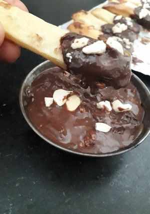 A picture of Sweet buttery Puff pastry with chocolate nuty sauce.