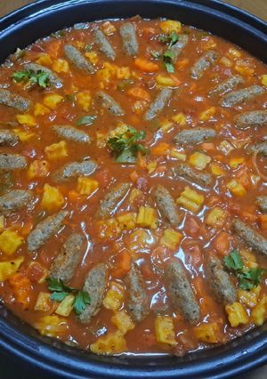 A picture of Kofta with Potatoes and Vegetables.