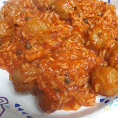 A picture of Red Rice with Meatballs.