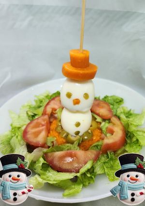 Una foto de Hombrecillo de nieve en colchón de ensalada