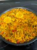 Paella de arroz con rejo
