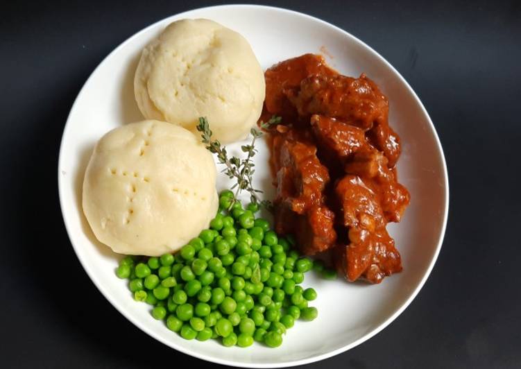 Lamb neck stew with mashed potatoes, and peas