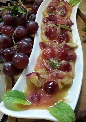 Foto di Arista in agret con vino bianco ed uva rossa