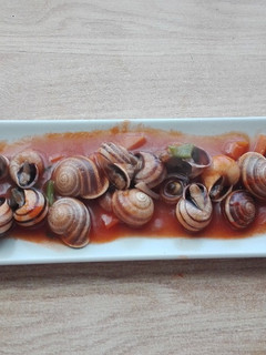 Una foto de Caracoles en salsa picante de Pretty Woman