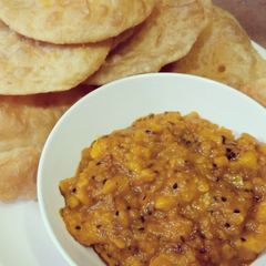 A picture of Daal kachori with tarkari.