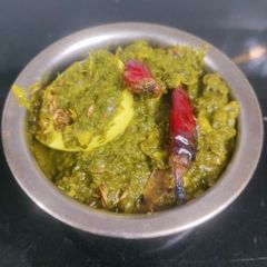 A picture of Egg spinach curry.