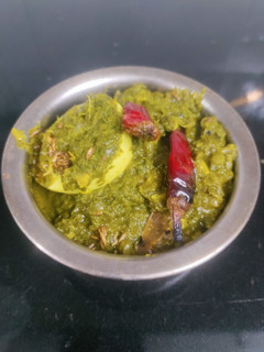 A picture of Egg spinach curry.