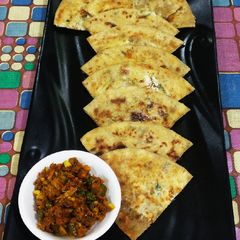 A picture of Gobhi & paneer ke paranthe with Haldi ka Achar.
