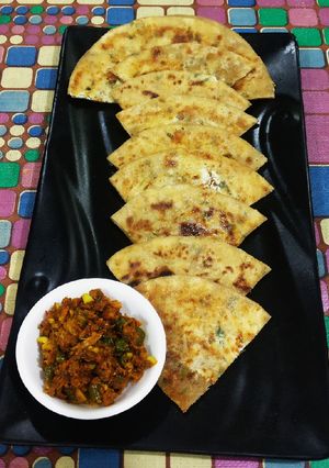 A picture of Gobhi & paneer ke paranthe with Haldi ka Achar.