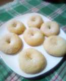 Rosquillas de maizena, anís baño de almíbar de canela coco ral